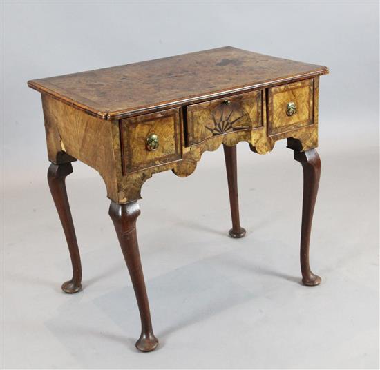 An early 18th century featherbanded walnut lowboy, W.2ft 6in. D.1ft 8in. H.2ft 4in.